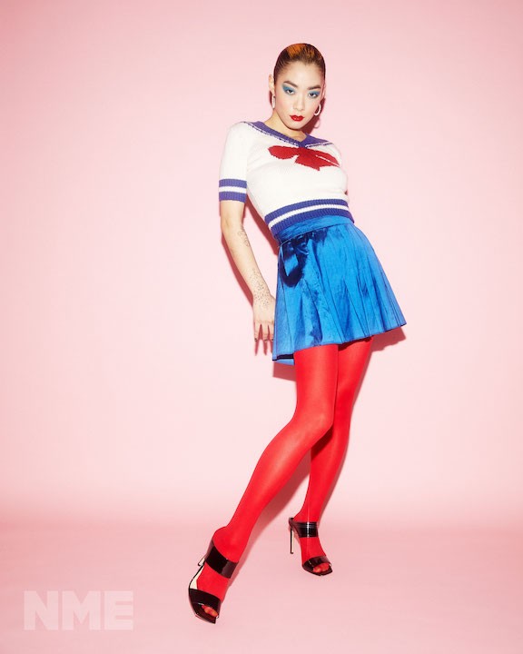 hotos by Zoe McConnell for NME. Top and Skirt by Gareth Wrighton, Shoes by Jimmy Choo, Earrings by Stephen Einhorn